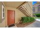 Charming entryway featuring a red door, landscaped surroundings, and convenient stair access at 2300 E Silverado Ranch Blvd # 1123, Las Vegas, NV 89183