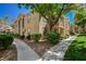 Inviting condo exterior with well-maintained landscaping and neutral color palette at 2300 E Silverado Ranch Blvd # 1123, Las Vegas, NV 89183