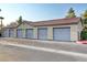 Well maintained garages showcasing gray doors and tan exterior at 2300 E Silverado Ranch Blvd # 1123, Las Vegas, NV 89183