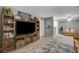 Cozy living room with a decorative fireplace, entertainment center, and hardwood-style flooring at 2300 E Silverado Ranch Blvd # 1123, Las Vegas, NV 89183