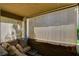 Relaxing covered patio featuring neutral toned decor, a comfy sofa, and shade screens at 2300 E Silverado Ranch Blvd # 1123, Las Vegas, NV 89183