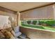 Cozy outdoor patio with roller shades and peaceful backyard views at 2300 E Silverado Ranch Blvd # 1123, Las Vegas, NV 89183
