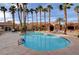 Gorgeous resort style pool surrounded by beautiful landscaping and majestic palm trees at 2300 E Silverado Ranch Blvd # 1123, Las Vegas, NV 89183