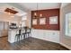 Elegant dining space with modern chandelier, custom-built cabinets, and views of the kitchen at 2305 Hot Oak Ridge St, Las Vegas, NV 89134