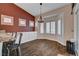 Cozy dining nook with large windows, stylish lighting, and a view of the patio at 2305 Hot Oak Ridge St, Las Vegas, NV 89134