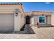 Inviting front entrance with stone walkway leading to the decorative front door and desert landscaping at 2305 Hot Oak Ridge St, Las Vegas, NV 89134