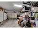 Spacious garage with overhead storage, cabinets, and organization solutions at 2305 Hot Oak Ridge St, Las Vegas, NV 89134