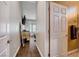 Hallway leading to a bedroom with modern wood flooring, ensuite bath, and neutral wall colors at 2305 Hot Oak Ridge St, Las Vegas, NV 89134