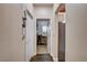 Hallway featuring hardwood floors leading to an office space and a view of the kitchen at 2305 Hot Oak Ridge St, Las Vegas, NV 89134