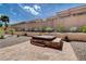 A built-in hot tub is surrounded by decorative gravel and landscaping in this backyard oasis at 2305 Hot Oak Ridge St, Las Vegas, NV 89134