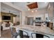 Open-concept kitchen with a large granite island, stainless steel appliances, and seamless flow into the living area at 2305 Hot Oak Ridge St, Las Vegas, NV 89134