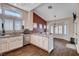 Modern kitchen with stainless steel appliances, granite countertops, and a view of the adjacent dining area at 2305 Hot Oak Ridge St, Las Vegas, NV 89134