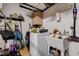 Convenient laundry room with washer, dryer, utility sink, and storage solutions at 2305 Hot Oak Ridge St, Las Vegas, NV 89134
