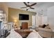 Inviting living room with plush furniture, stylish decor, a large TV, and hardwood floors at 2305 Hot Oak Ridge St, Las Vegas, NV 89134