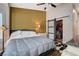 Comfortable main bedroom with a walk-in closet, large bed, bedside tables, and neutral decor at 2305 Hot Oak Ridge St, Las Vegas, NV 89134