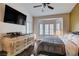 Spacious main bedroom with a bay window, natural light, dresser, and a comfortable bed at 2305 Hot Oak Ridge St, Las Vegas, NV 89134