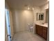Bright bathroom featuring a vanity, toilet, and tiled floor at 2321 Teatro Ave, Henderson, NV 89044