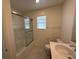 Bathroom featuring a glass-enclosed shower, sink, and vanity, combining practicality with contemporary design at 2321 Teatro Ave, Henderson, NV 89044