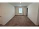 This bedroom features carpet flooring, a window, and ample natural light, creating a comfortable and inviting space at 2321 Teatro Ave, Henderson, NV 89044