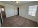 Bedroom featuring carpet, closet and a large window allowing natural light, creating a peaceful retreat at 2321 Teatro Ave, Henderson, NV 89044