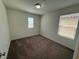 Carpeted bedroom with natural light streaming through windows, creating a cozy and inviting atmosphere at 2321 Teatro Ave, Henderson, NV 89044