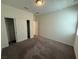 Cozy bedroom with plush carpet, closet, and a bright window at 2321 Teatro Ave, Henderson, NV 89044