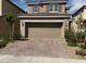 Charming two-story home featuring a two-car garage and a well-maintained, low-water, desert landscaped front yard at 2321 Teatro Ave, Henderson, NV 89044