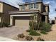 Charming two-story home featuring a two-car garage and a well-maintained, low-water, desert landscaped front yard at 2321 Teatro Ave, Henderson, NV 89044