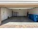 Spacious two car garage with ample room for storage and brick flooring at 2321 Teatro Ave, Henderson, NV 89044