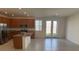 Spacious open-concept kitchen with an island, stainless steel appliances, and elegant tile flooring at 2321 Teatro Ave, Henderson, NV 89044