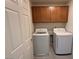 Laundry room featuring washer, dryer, and upper cabinets for storage at 2321 Teatro Ave, Henderson, NV 89044