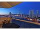 Balcony view showcasing the city skyline at night, with a table and chairs for enjoying the vista at 2747 Paradise Rd # 1703, Las Vegas, NV 89109