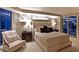 Serene main bedroom with a luxurious upholstered bed, accent wall, and city views at 2747 Paradise Rd # 1703, Las Vegas, NV 89109