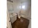 Compact bathroom featuring a standard tub, toilet, vanity, and tile flooring at 2820 Fort Sumter Dr, North Las Vegas, NV 89030