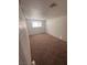 Cozy bedroom with neutral walls, carpet flooring, and a window offering outdoor views at 2820 Fort Sumter Dr, North Las Vegas, NV 89030