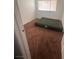 Bedroom featuring a brown carpet, an air mattress and a window at 2820 Fort Sumter Dr, North Las Vegas, NV 89030