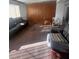 Spacious living room with older furniture and a large window providing natural light at 2820 Fort Sumter Dr, North Las Vegas, NV 89030