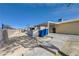 Landscaped backyard featuring a covered patio, block wall and a concrete walkway at 2832 Geist Cir, Las Vegas, NV 89115