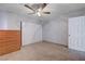 Neutral bedroom with tiled floors, ceiling fan, and built-in closet at 2832 Geist Cir, Las Vegas, NV 89115