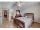Bedroom featuring access to the bathroom and tiled floors at 2832 Geist Cir, Las Vegas, NV 89115