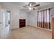 Bedroom featuring tiled floors, ceiling fan, and an open doorway at 2832 Geist Cir, Las Vegas, NV 89115