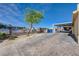 Wide stamped concrete driveway leading to the covered carport, enhancing curb appeal at 2832 Geist Cir, Las Vegas, NV 89115