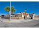 Street corner view of a well-maintained single-story home behind a decorative concrete block and wrought iron fence at 2832 Geist Cir, Las Vegas, NV 89115