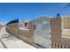 Close up of the entrance to a charming, fenced home, providing security and curb appeal at 2832 Geist Cir, Las Vegas, NV 89115