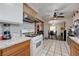 Bright kitchen features granite counters, stainless steel appliances, tile floors, and an open floor plan to other rooms at 2832 Geist Cir, Las Vegas, NV 89115