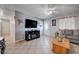 Inviting living room with a modern entertainment center and tile flooring at 2832 Geist Cir, Las Vegas, NV 89115