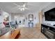 Inviting living room features tile floors, a modern TV, and ample seating at 2832 Geist Cir, Las Vegas, NV 89115