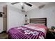 Cozy main bedroom features carpet floors, a ceiling fan, closet and natural light at 2832 Geist Cir, Las Vegas, NV 89115