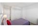 Cozy bedroom featuring a twin bed, closet, and a lamp on the nightstand at 2877 Sweeping Palm Rd, North Las Vegas, NV 89086