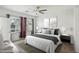 Comfortable bedroom featuring a large window and neutral decor at 2877 Sweeping Palm Rd, North Las Vegas, NV 89086